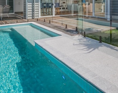 white granite pool pavers around swimming pool