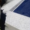 white granite drop face pool coping