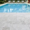 Ivory travertine french pattern around pool
