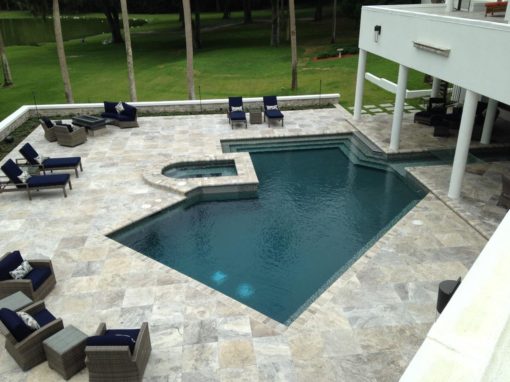 oyster silver travertine tiles around swimming pool by stone pavers melbourne