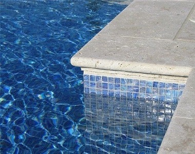 Ivory Travertine Bullnose Pool coping tiles, cream pool coping tiles, round edge pool coping tiles by stone pavers