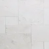 white limestone pavers in a french pattern tile