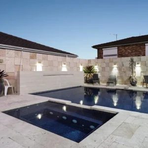 rustica travertine tiles around pool area