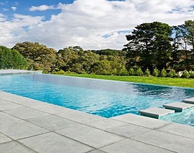 granite pavers around a pool